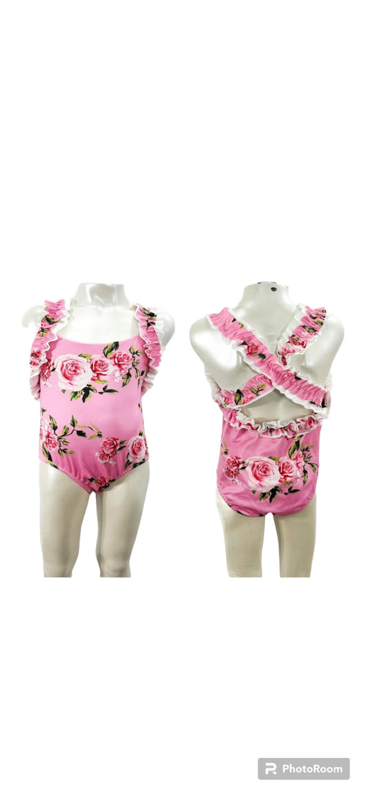 Girls pink floral swimsuit with cross back design (comes up slightly small)