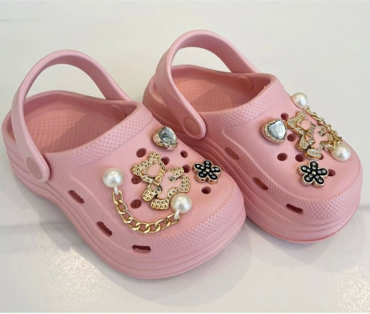 Girls pink crocs with charms